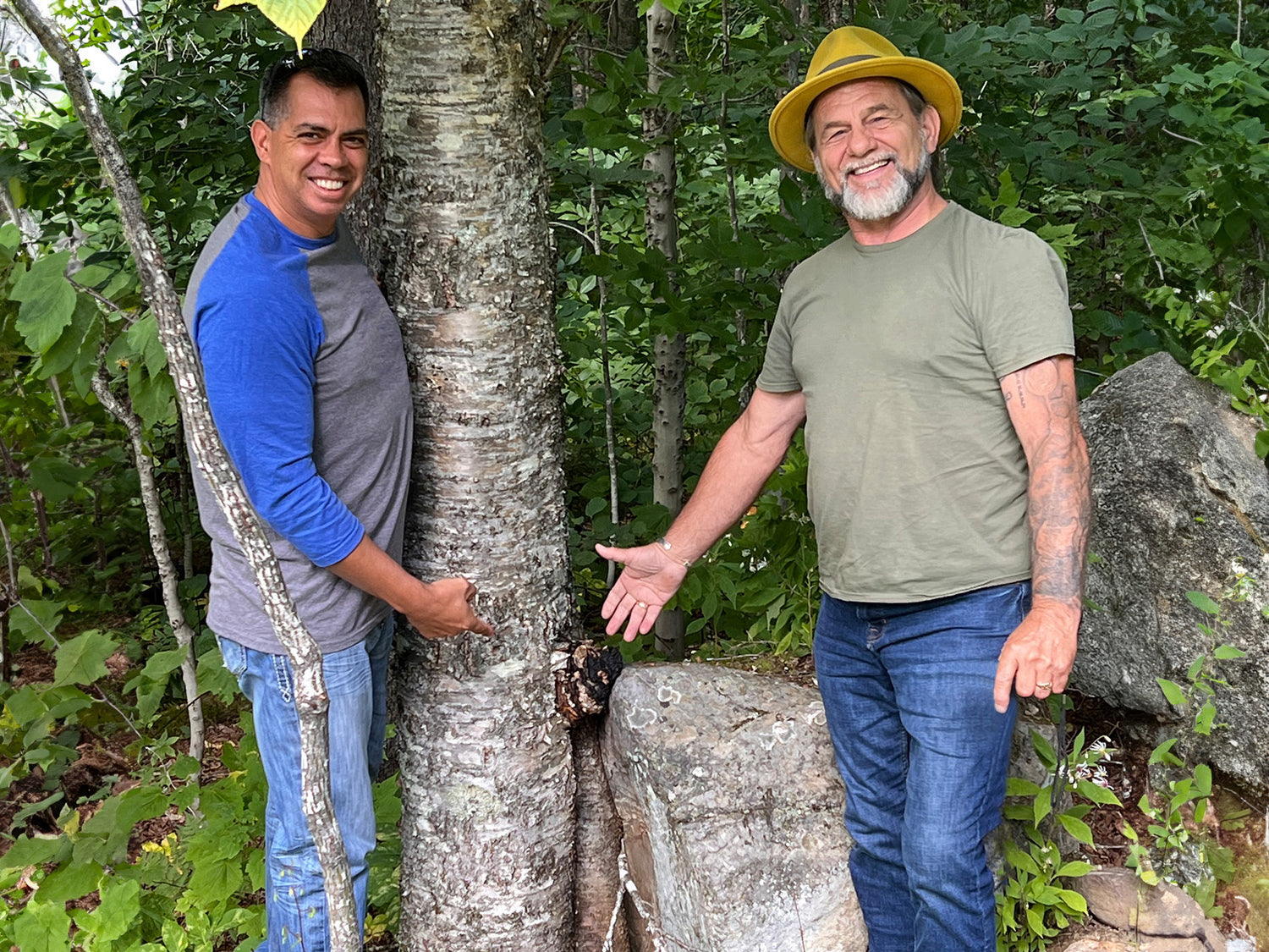 Rich and Mark in the woods with a chaga mushroom